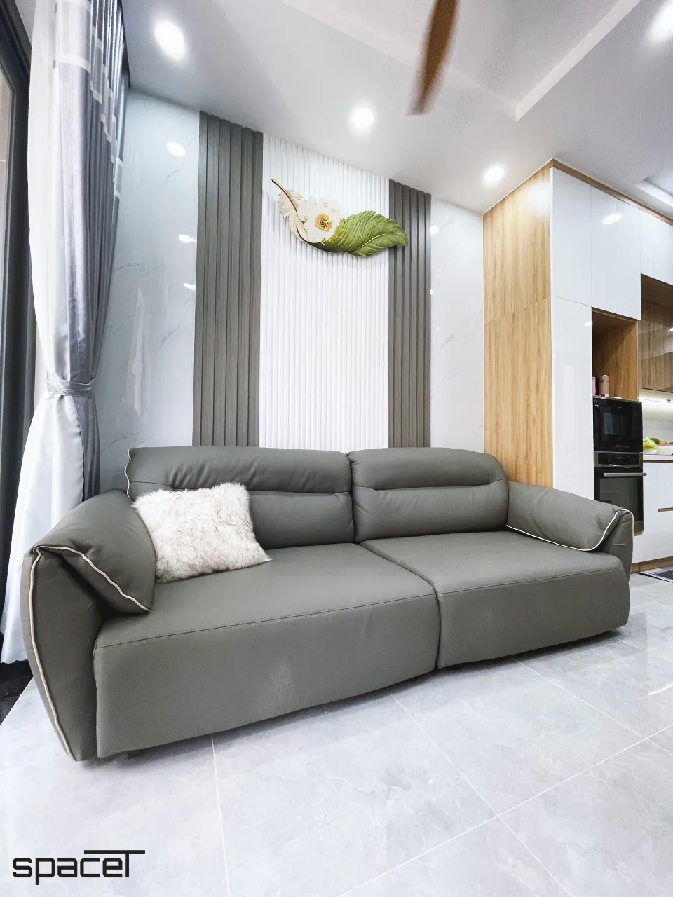 Hoàn thiện nội thất phòng khách nhà phố Quận 12 phong cách hiện đại Modern