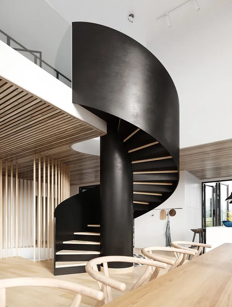 Cầu thang xoắn ốc dạng cột chống từ bê tông với mặt bậc ốp gỗ, phối màu theo phong cách tương phản tạo điểm nhấn ấn tượng cho không gian. 
