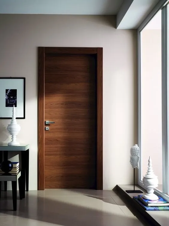 Cửa phòng ngủ bằng gỗ tự nhiên là chất liệu phổ biến hiện nay 