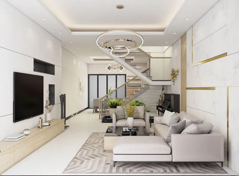 Phòng khách có cầu thang với tone màu trắng đặc trưng của phong cách scandinavian, kết hợp cùng đèn chùm thả cách điệu, mang đến một tổng thể sang trọng cho cả căn phòng