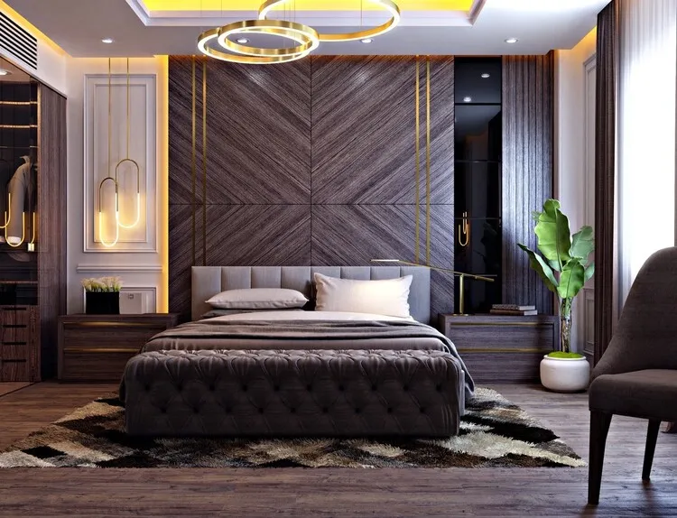 Phòng ngủ master diện tích lớn với tông màu nâu gỗ và trắng, phòng thay đồ được bố trí bên trái gian phòng.