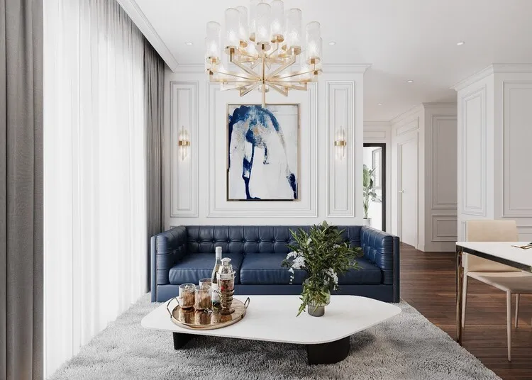 Phòng khách chung cư thiết kế theo phong cách hiện đại kết hợp tân cổ điển với tông màu xanh biển và trắng trang nhã.