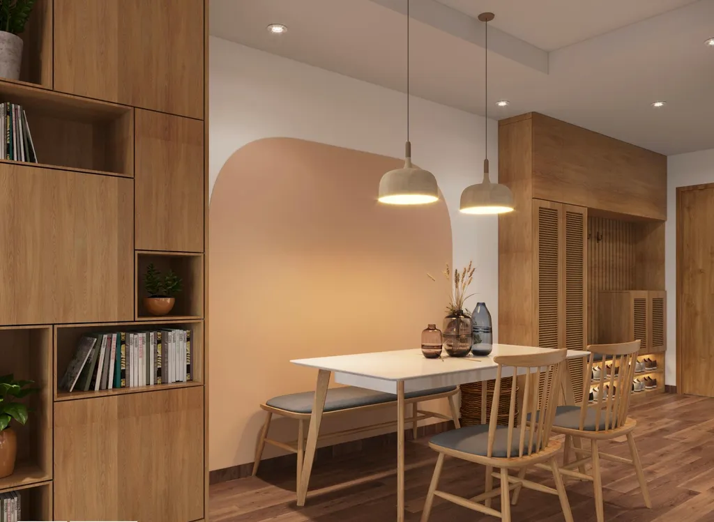 Không gian phòng khách và bếp nối liền, giúp tối ưu diện tích. Khu vực bàn ăn ấm cúng với đèn thả trần sắc vàng