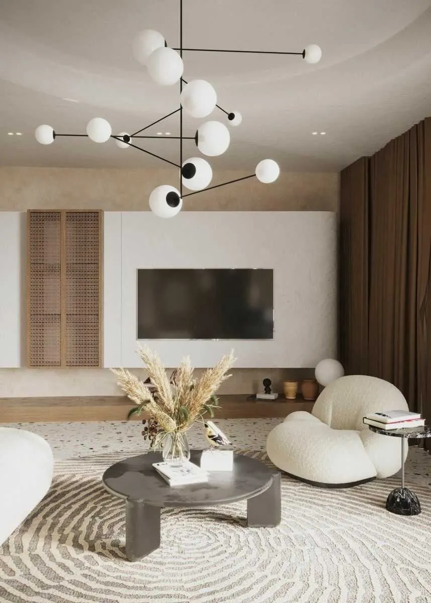 Khu vực phòng khách được thiết kế đơn giản với sofa và đèn chùm màu trắng
