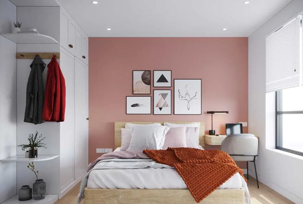 Phòng ngủ theo phong cách Bắc Âu với gam hồng, gỗ và nâu đỏ tạo nên cảm giác ấm cúng, thoải mái.