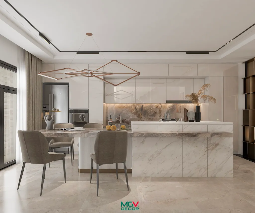 Để tạo được sự liền mạch với phòng khách, khu vực bếp ăn cũng được sử dụng nội thất có tone màu trung tính, từ các chất liệu như gỗ tự nhiên, đá hoa cương nhằm mang đến vẻ đẹp hài hòa và đảm bảo đúng phong cách của ngôi nhà
