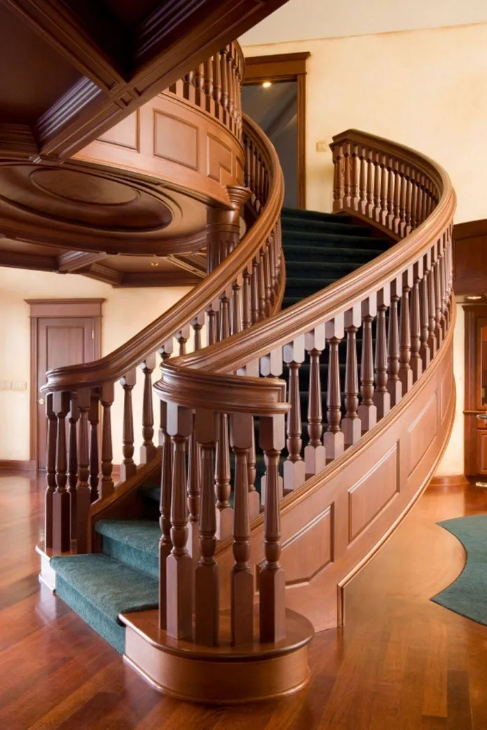 Lan can cầu thang bằng gỗ thiết kế uốn cong kết hợp trụ và bậc thang gỗ