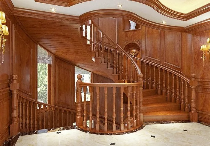 Cầu thang gỗ đẹp làm từ gỗ tự nhiên lắp đặt trong không gian có nội thất chủ đạo là gỗ