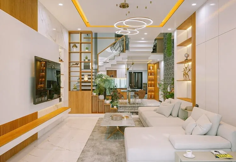 Phòng khách nhà ống 5m với tông màu trắng và vàng nâu gỗ làm chủ đạo, đan xen màu xanh tự nhiên để làm dịu không gian và tăng cảm giác thư thái.
