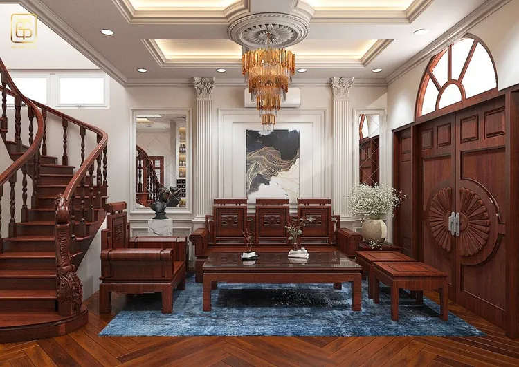 Mẫu phòng khách mang nét Á Đông với các bức tranh nghệ thuật, đèn chùm sang trọng và bộ ghế được gia công tỉ mỉ, tạo nên sự lịch lãm và tinh tế.